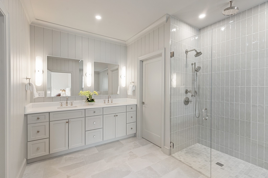 8 Common Court Lexington, MA 02421 - Photo 20 of 31 a spacious bathroom with a shower sink and mirror