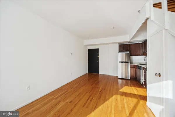 a view of kitchen with wooden floor