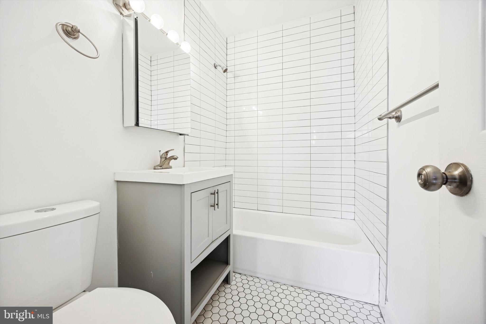 319 South 10th Street, Unit 335 Philadelphia, PA 19107 - Photo 9 of 15 a bathroom with a sink toilet and shower