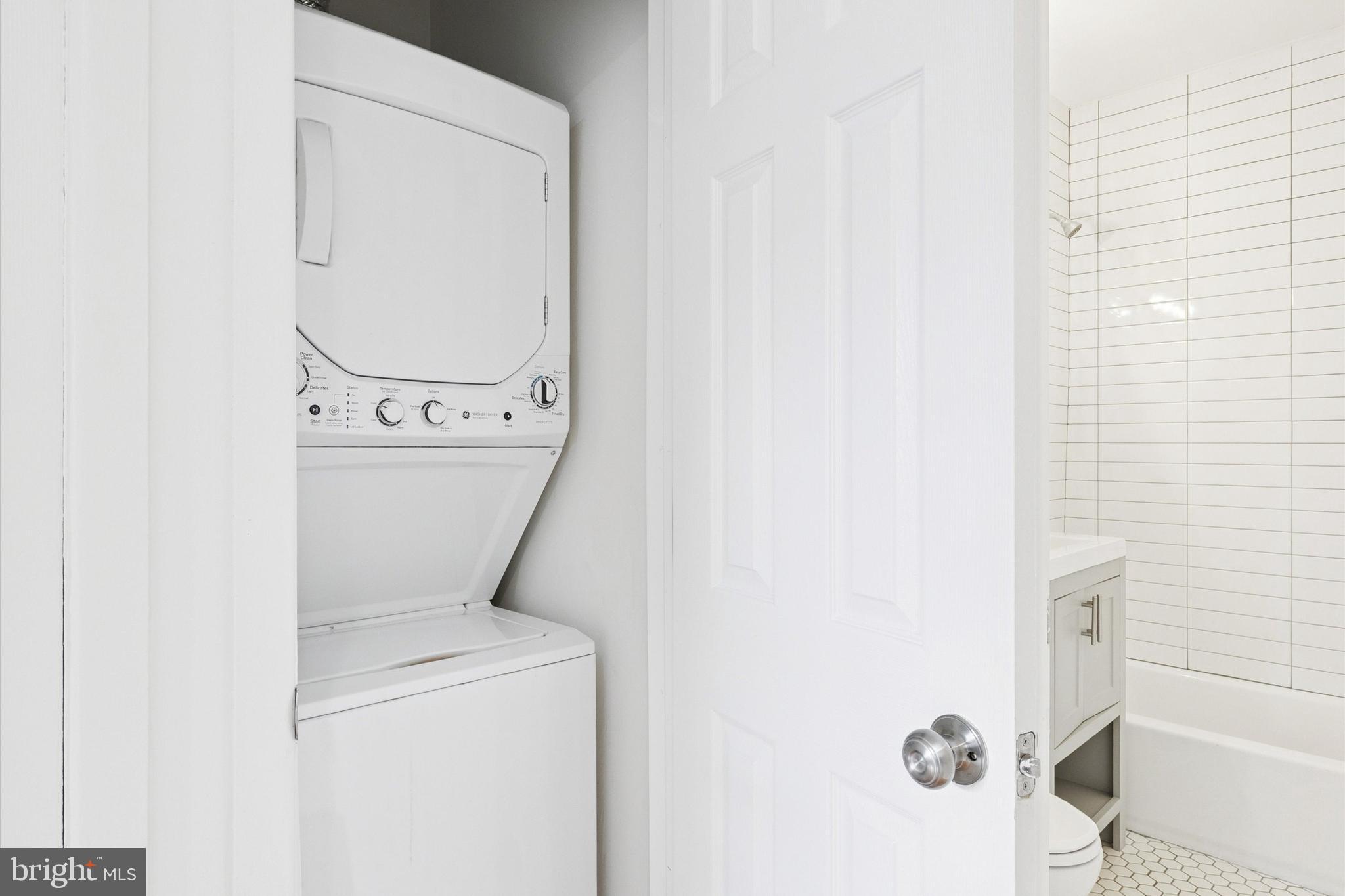 319 South 10th Street, Unit 335 Philadelphia, PA 19107 - Photo 10 of 15 a utility room with dryer and washer