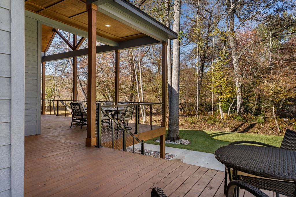 1248 Sunset Road Epworth, GA 30541 - Photo 66 of 71 a view of a chairs and table in patio with a backyard