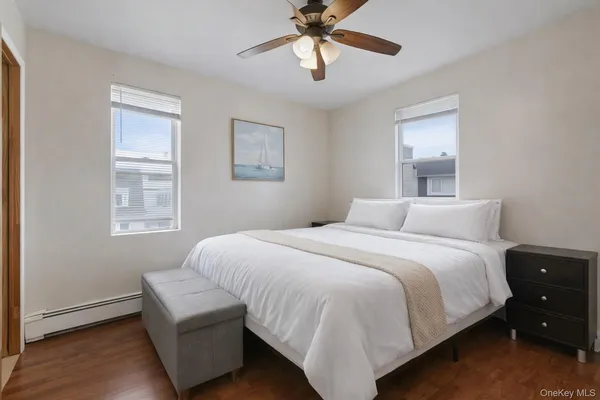a bedroom with bed and window