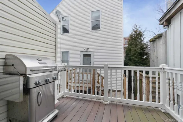 a view of a balcony with wooden floor