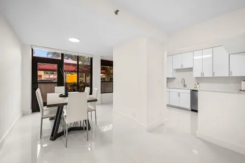 a kitchen with a table and chairs