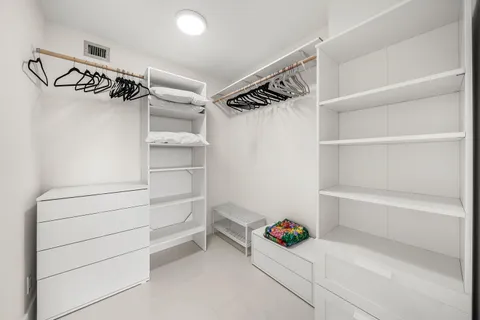 a view of an empty walk in closet