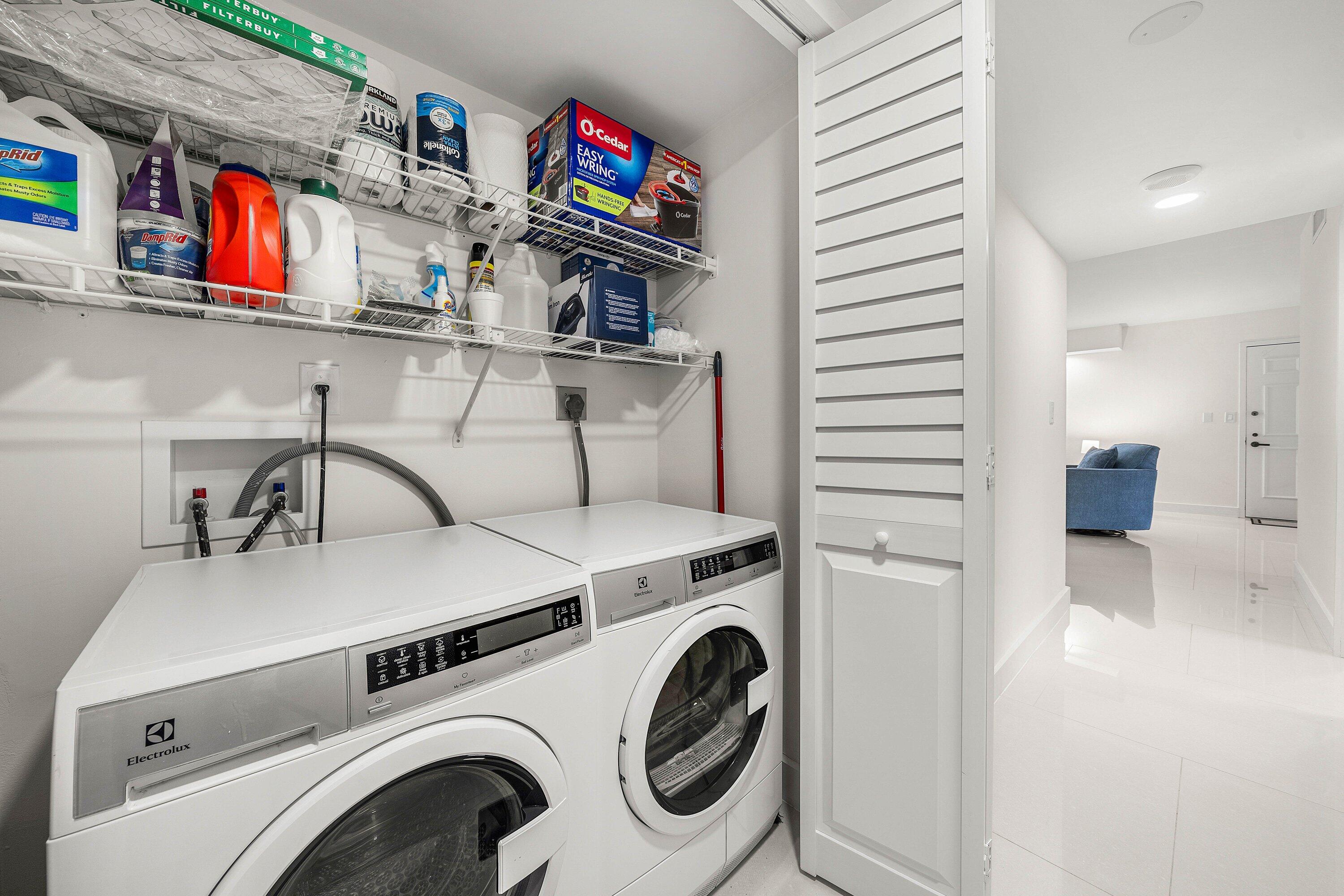 7145 Promenade Drive, Unit 101 Boca Raton, FL 33433 - Photo 24 of 35 a utility room with dryer and washer