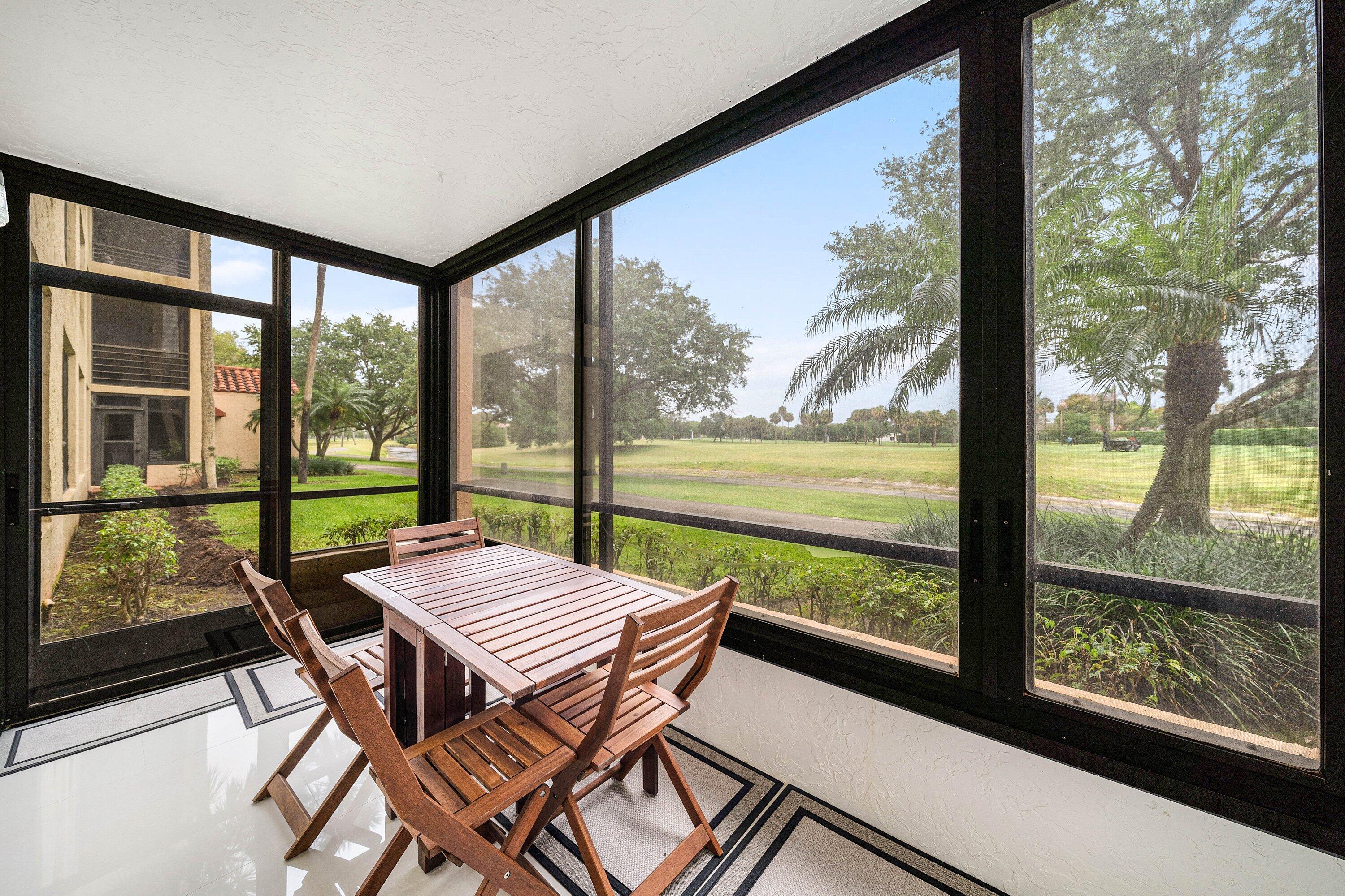 7145 Promenade Drive, Unit 101 Boca Raton, FL 33433 - Photo 27 of 35 a view of a city from a balcony with furniture