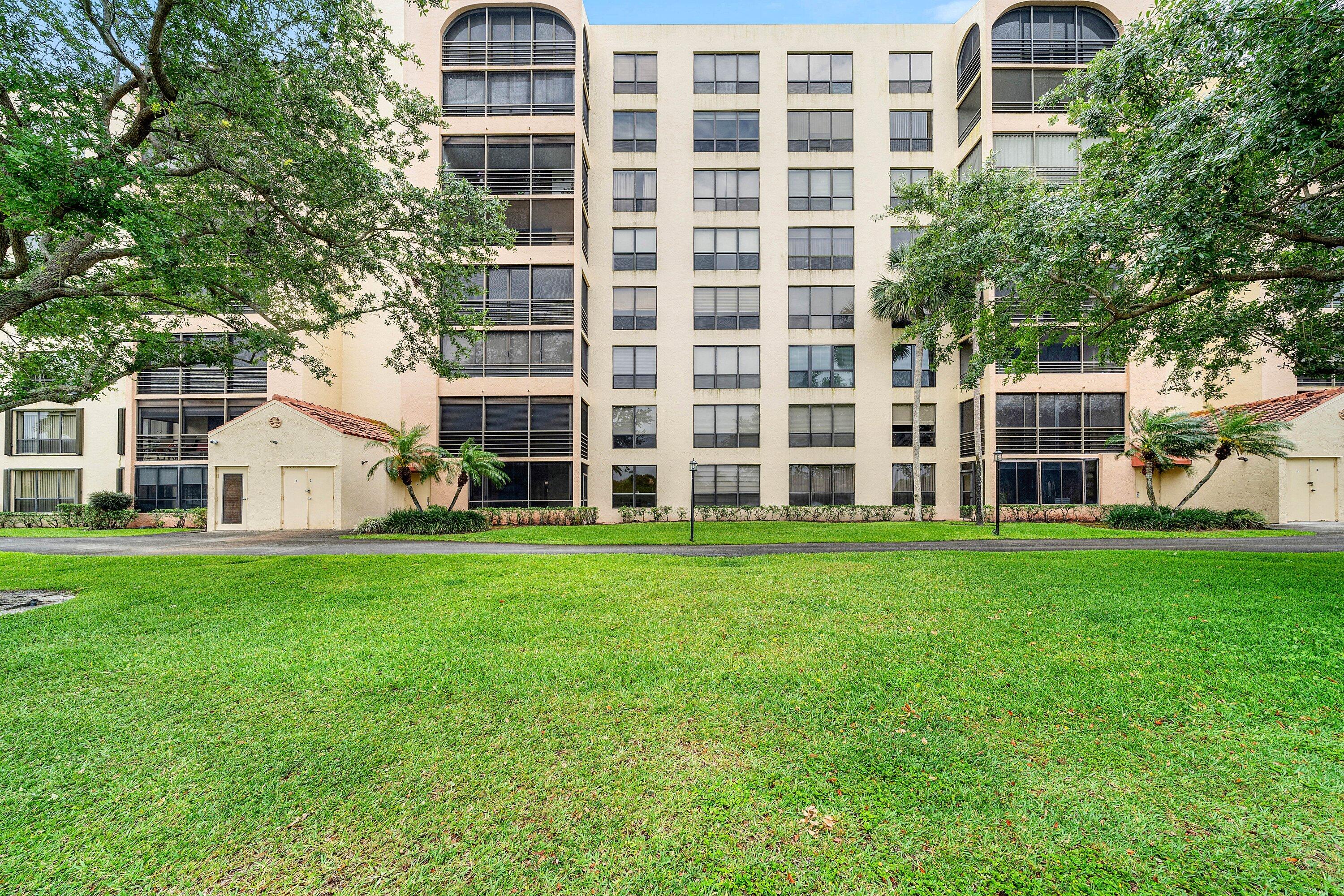 7145 Promenade Drive, Unit 101 Boca Raton, FL 33433 - Photo 29 of 35 front view of a house with a yard
