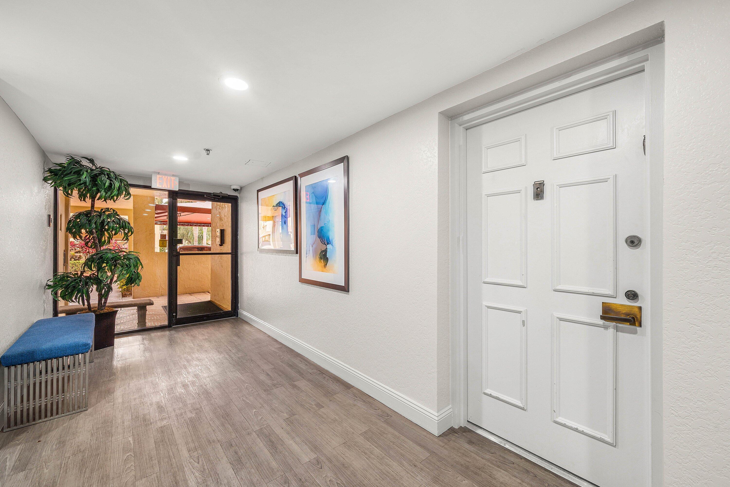 7145 Promenade Drive, Unit 101 Boca Raton, FL 33433 - Photo 3 of 35 wooden floor in an empty room