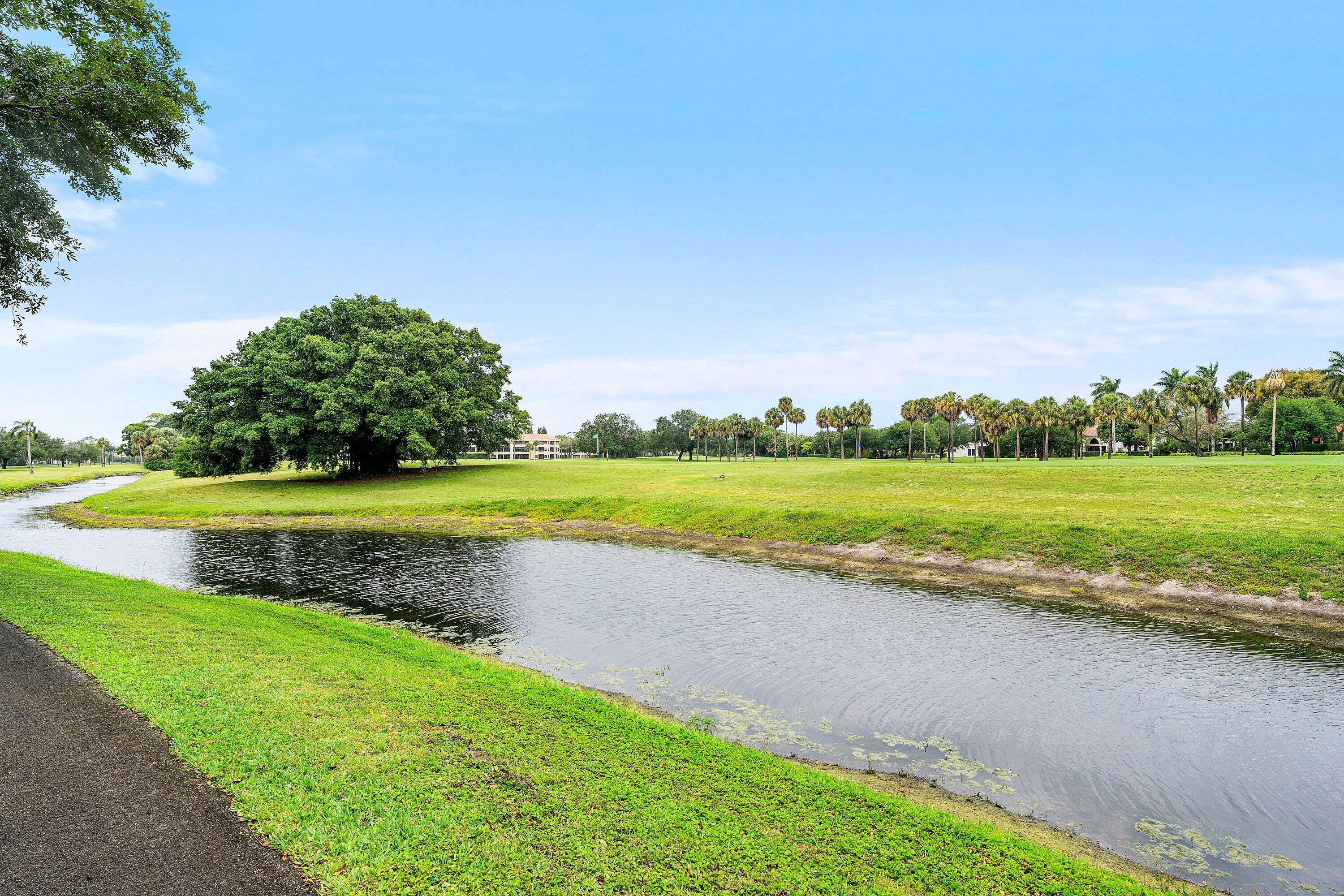 7145 Promenade Drive, Unit 101 Boca Raton, FL 33433 - Photo 32 of 35 a view of a swimming pool and a yard
