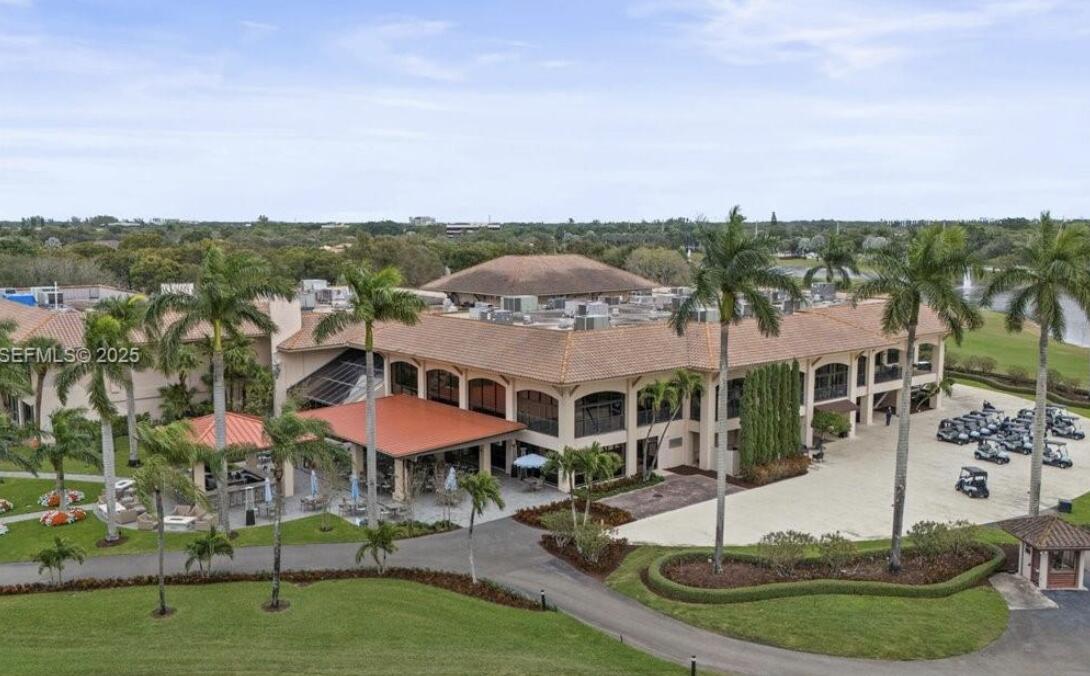7145 Promenade Drive, Unit 101 Boca Raton, FL 33433 - Photo 35 of 35 a view of a swimming pool with a yard and lake view