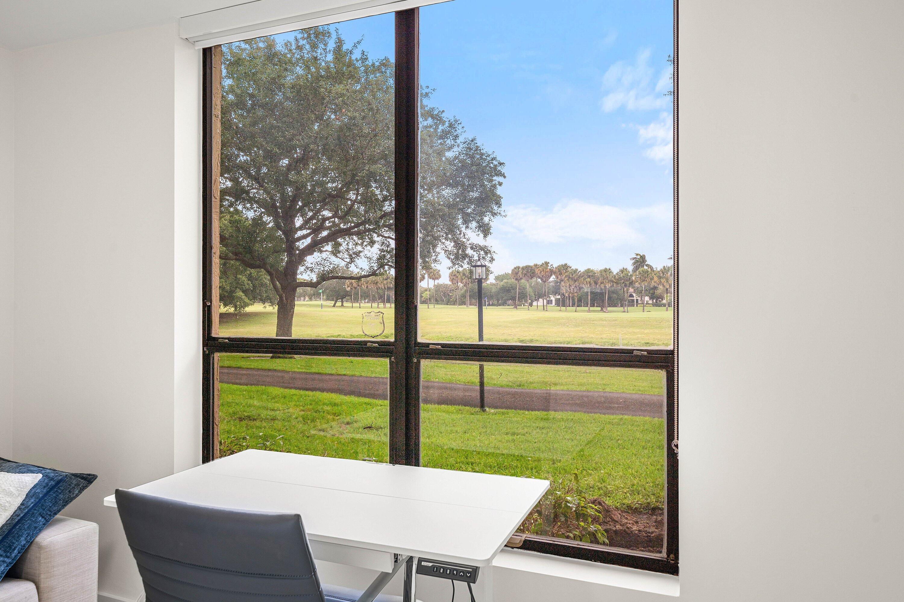 7145 Promenade Drive, Unit 101 Boca Raton, FL 33433 - Photo 10 of 35 a view of a city from a dining room with a floor to ceiling window and lake view