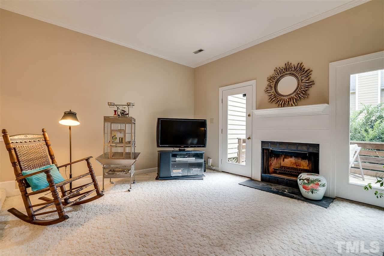 403 Danforth Drive Cary, NC 27511 - Photo 11 of 25 a living room with furniture and a fireplace