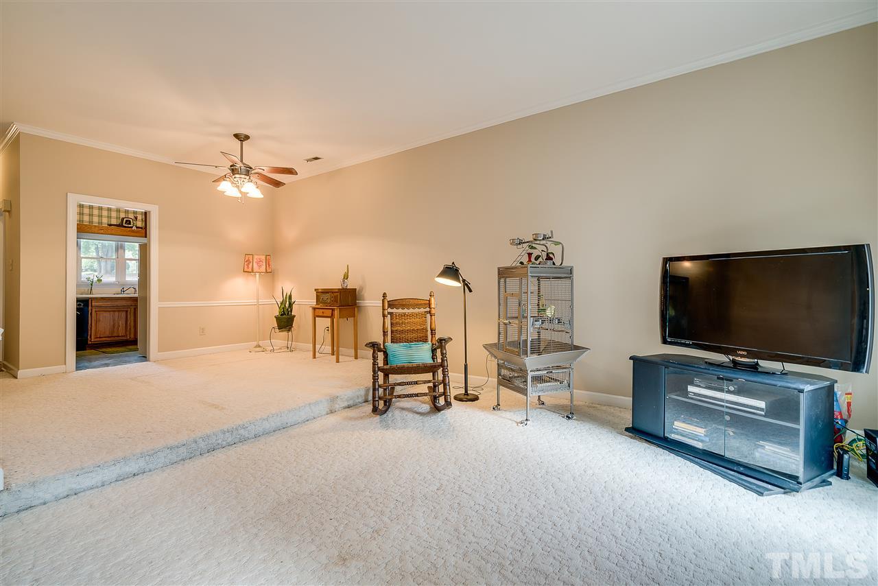 403 Danforth Drive Cary, NC 27511 - Photo 13 of 25 a living room with furniture and flat screen tv