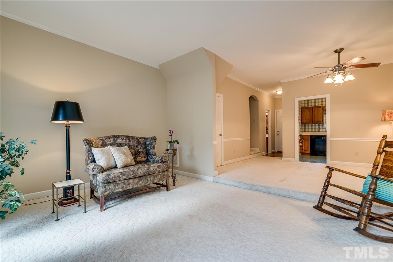 403 Danforth Drive Cary, NC 27511 - Photo 14 of 25 a living room with furniture and a chandelier