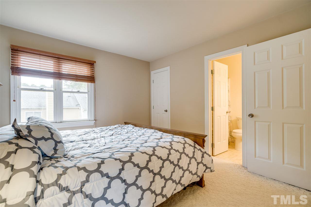 403 Danforth Drive Cary, NC 27511 - Photo 16 of 25 a bedroom with a bed and a window