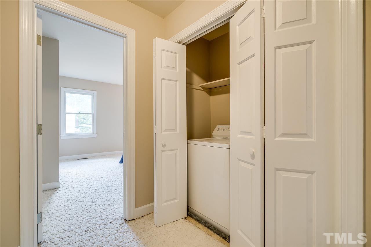 403 Danforth Drive Cary, NC 27511 - Photo 18 of 25 a view of a bathroom with a glass door