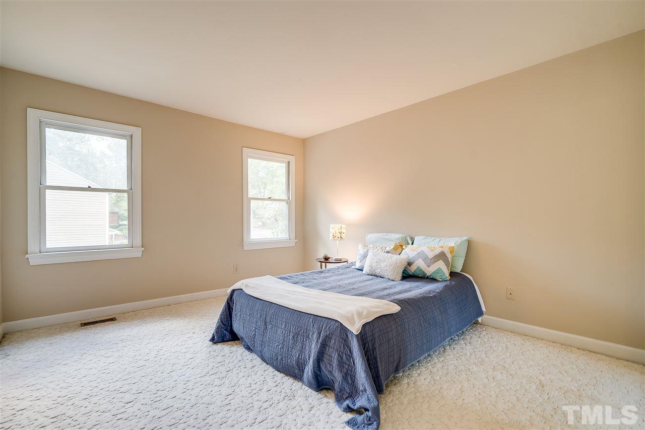 403 Danforth Drive Cary, NC 27511 - Photo 19 of 25 a bedroom with a bed and window