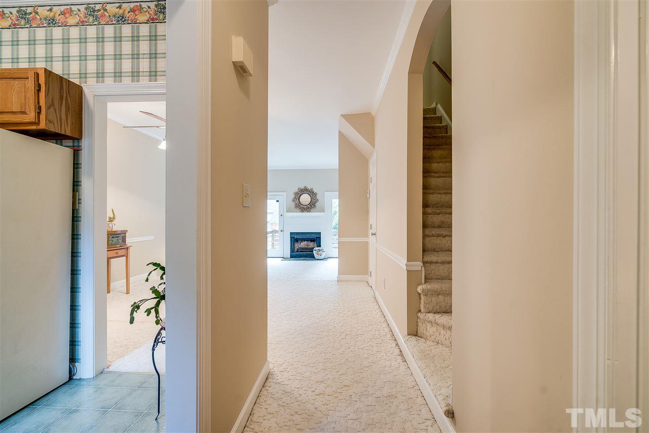 403 Danforth Drive Cary, NC 27511 - Photo 3 of 25 a view of a hallway with white walls and windows