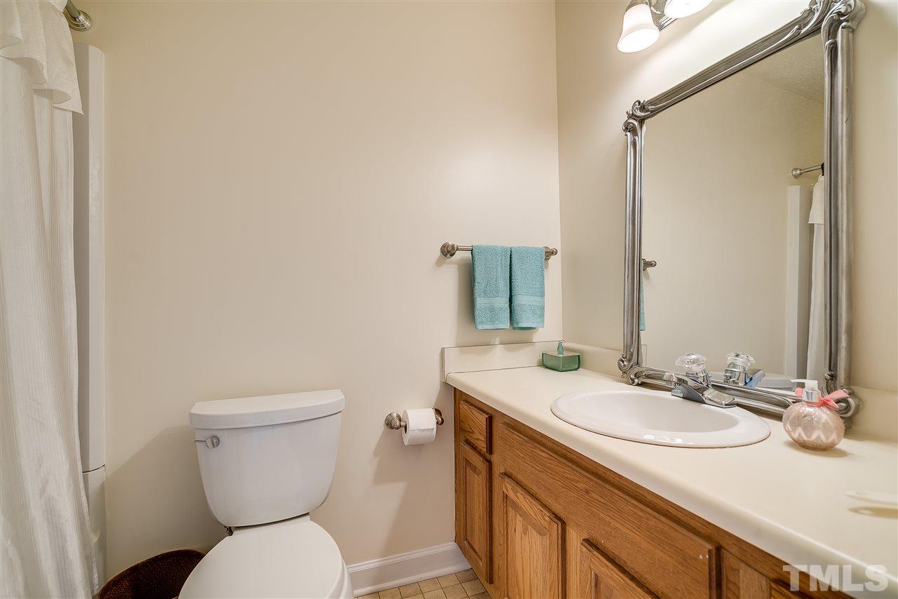 403 Danforth Drive Cary, NC 27511 - Photo 21 of 25 a bathroom with a sink toilet and mirror
