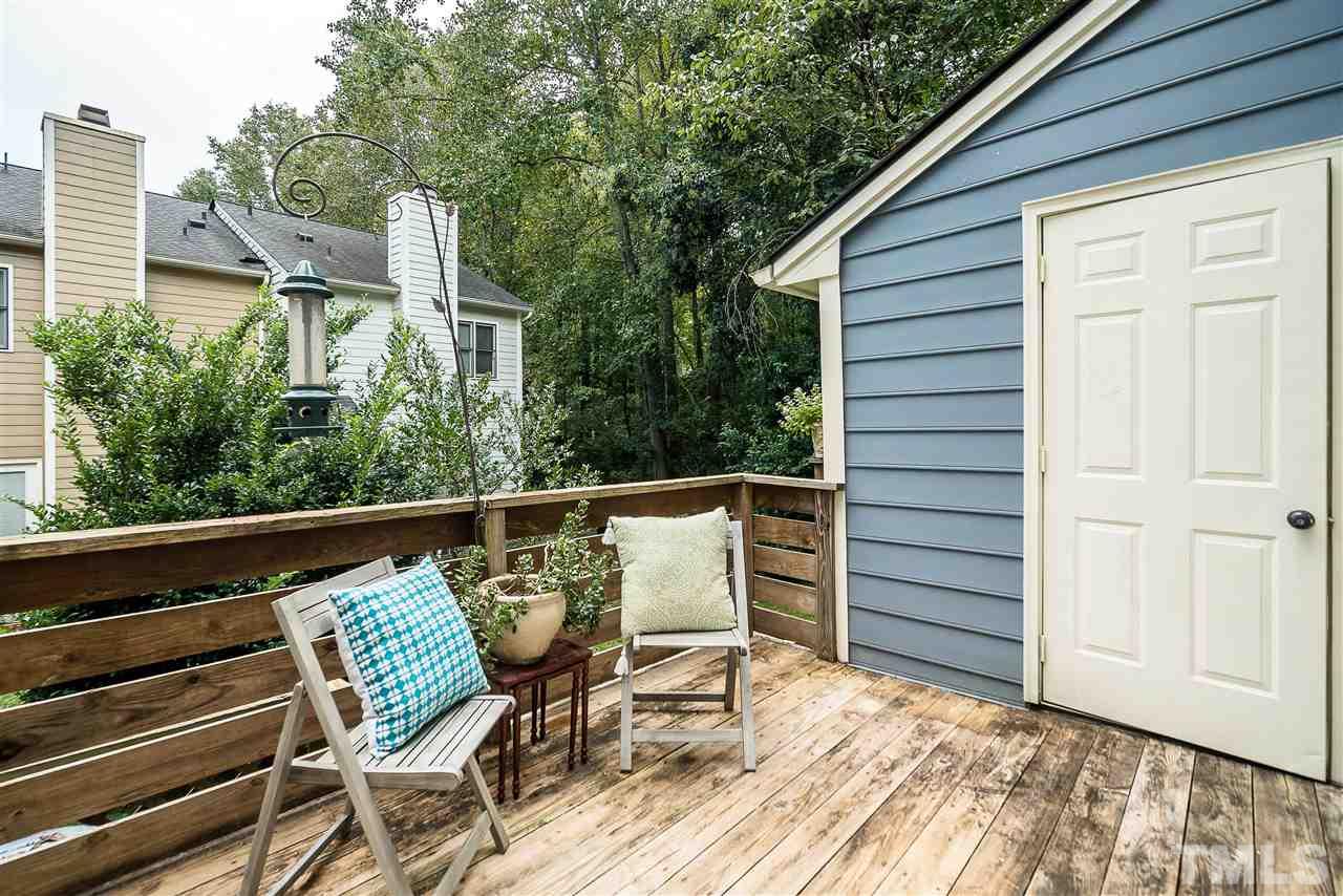403 Danforth Drive Cary, NC 27511 - Photo 22 of 25 a balcony with table and chairs