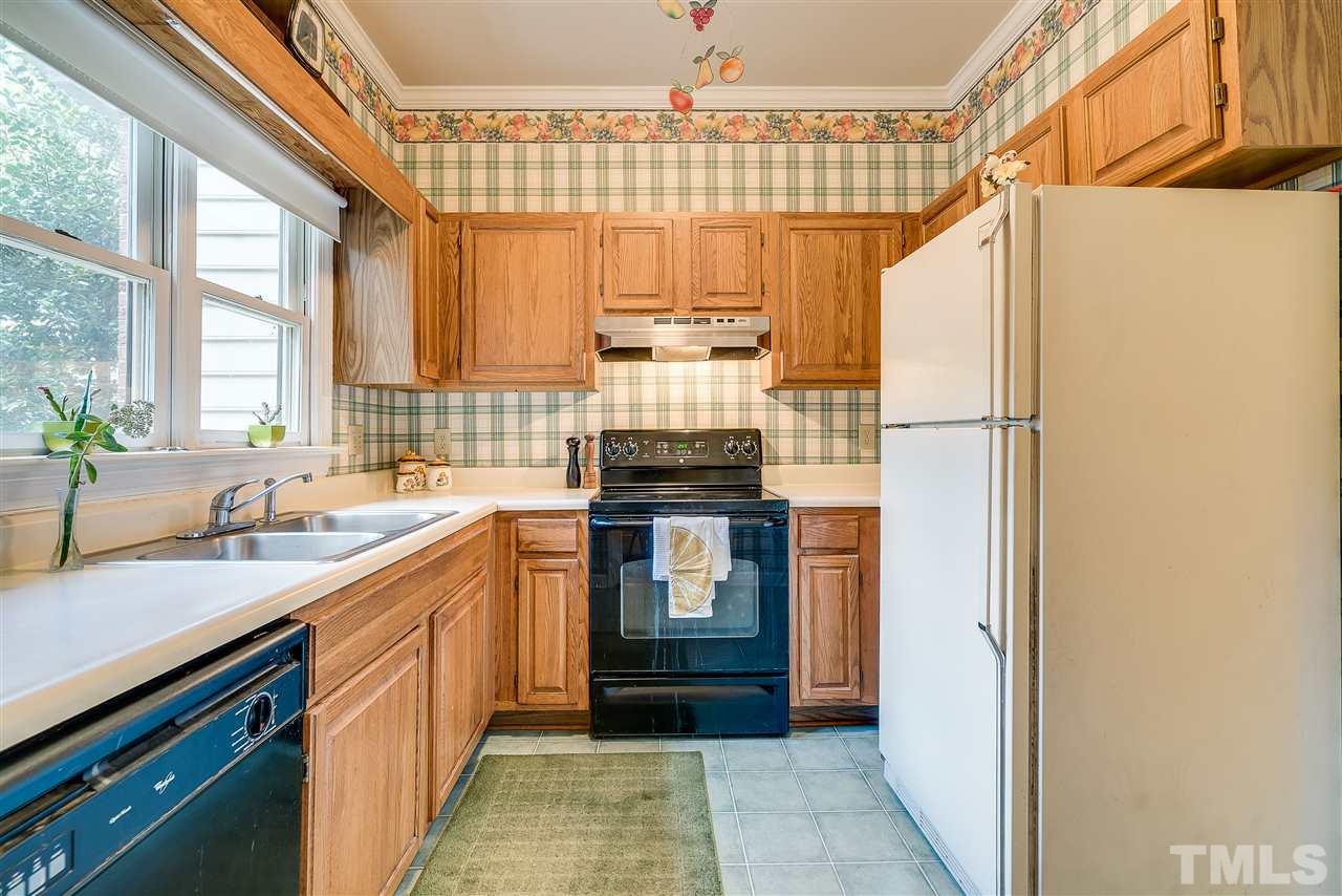 403 Danforth Drive Cary, NC 27511 - Photo 5 of 25 a kitchen with a sink and a refrigerator