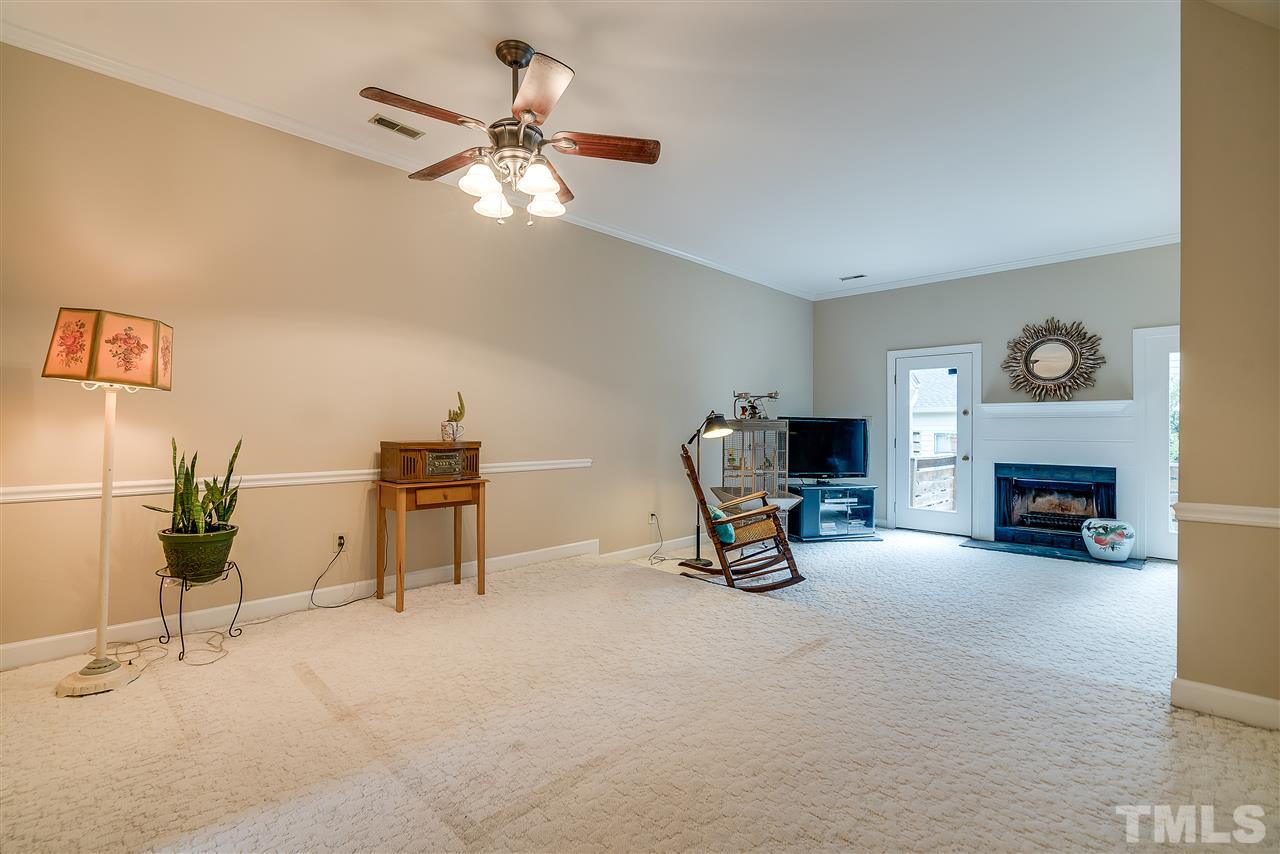403 Danforth Drive Cary, NC 27511 - Photo 8 of 25 a living room with furniture and a fireplace
