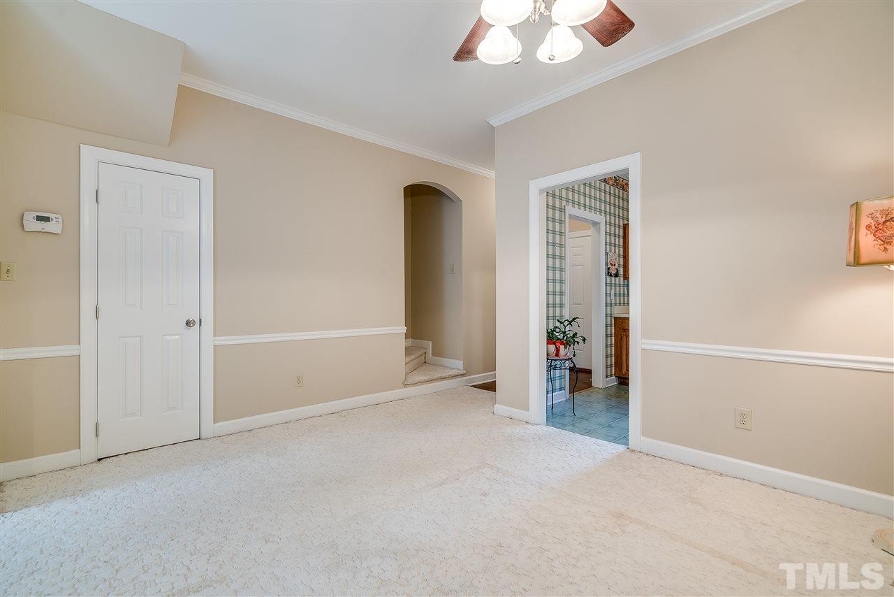 403 Danforth Drive Cary, NC 27511 - Photo 9 of 25 an empty room with ceiling fan