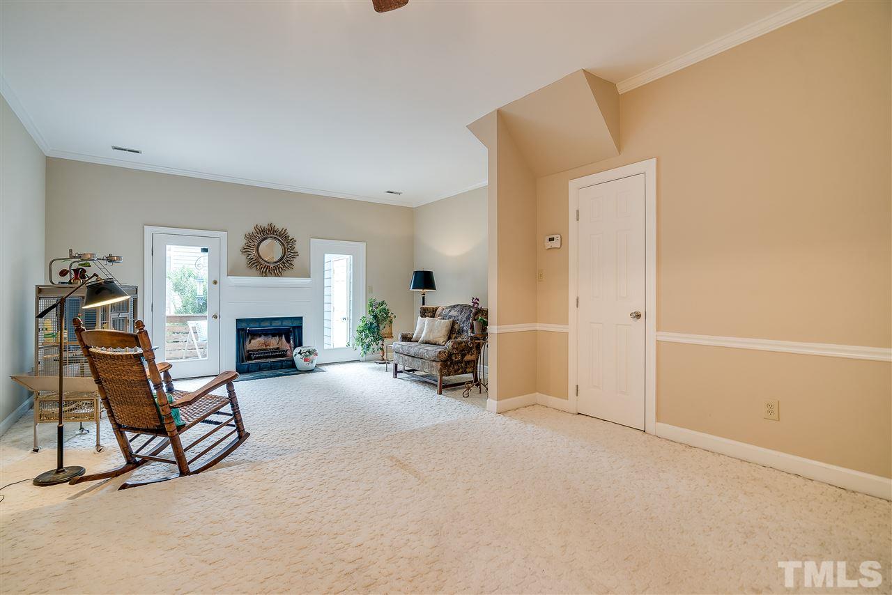 403 Danforth Drive Cary, NC 27511 - Photo 10 of 25 a living room with furniture and a fireplace