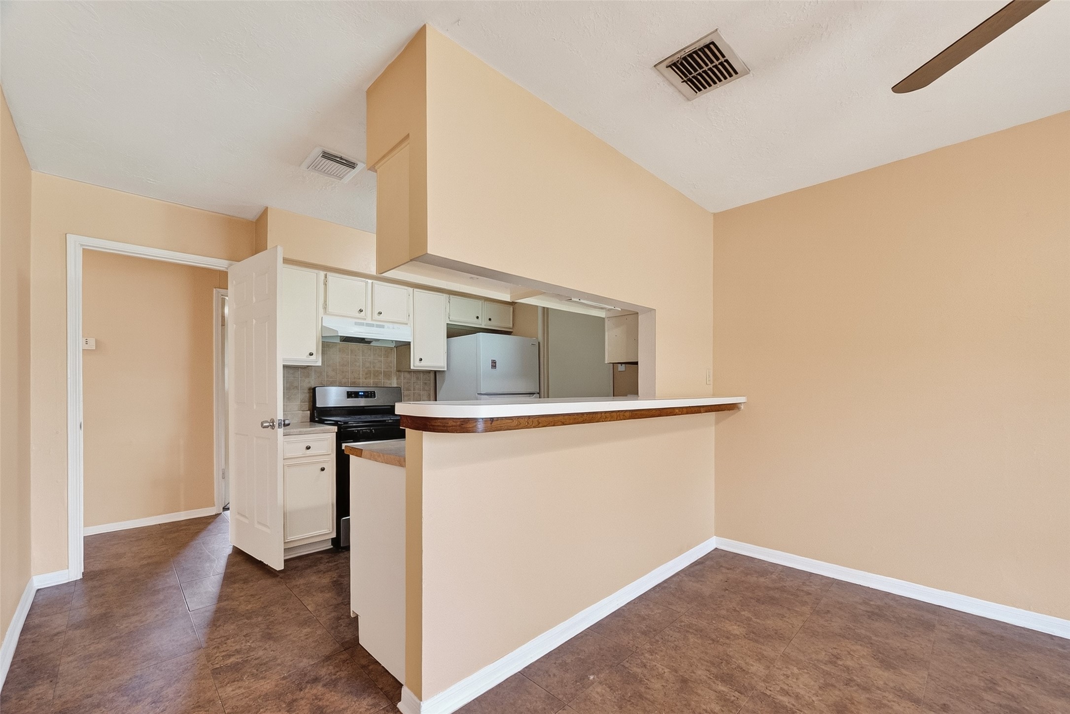 4826 Redfish Reef Drive Bacliff, TX 77518 - Photo 8 of 25 a kitchen with stainless steel appliances a refrigerator and a stove