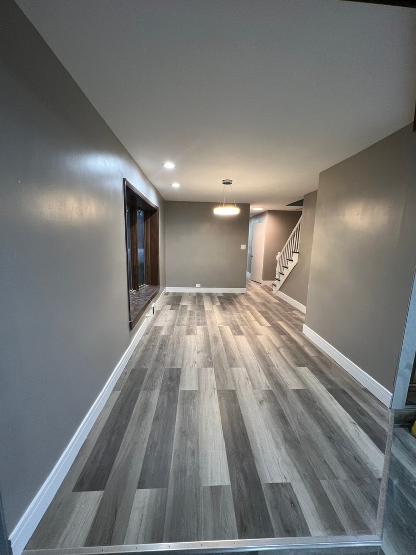 1631 Dundee Road Northbrook, IL 60062 - Photo 11 of 20 a view of hallway with a large window