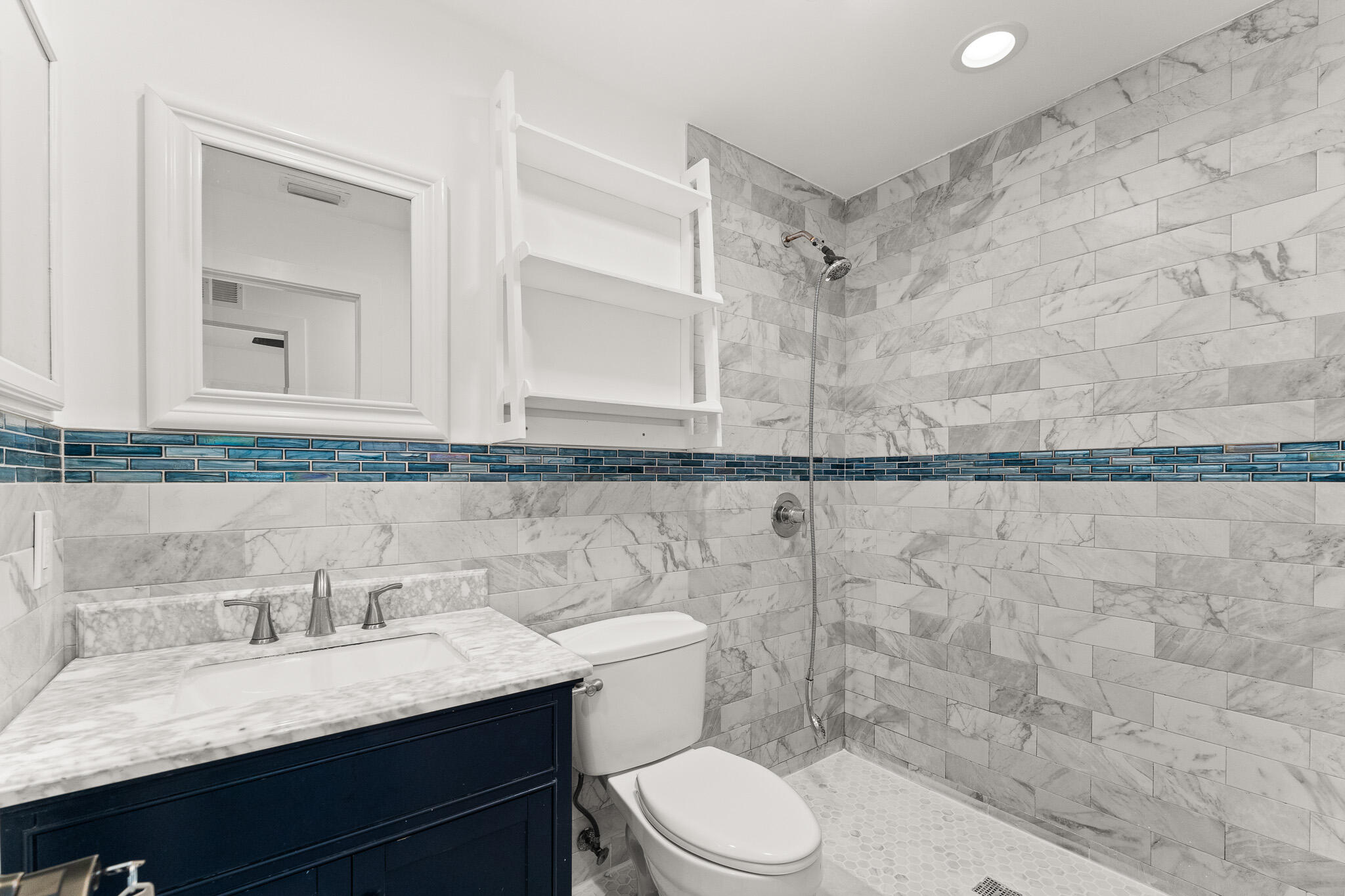 1575 Southwest Fresno Road Port St. Lucie, FL 34953 - Photo 24 of 27 a bathroom with a granite countertop sink mirror vanity and toilet