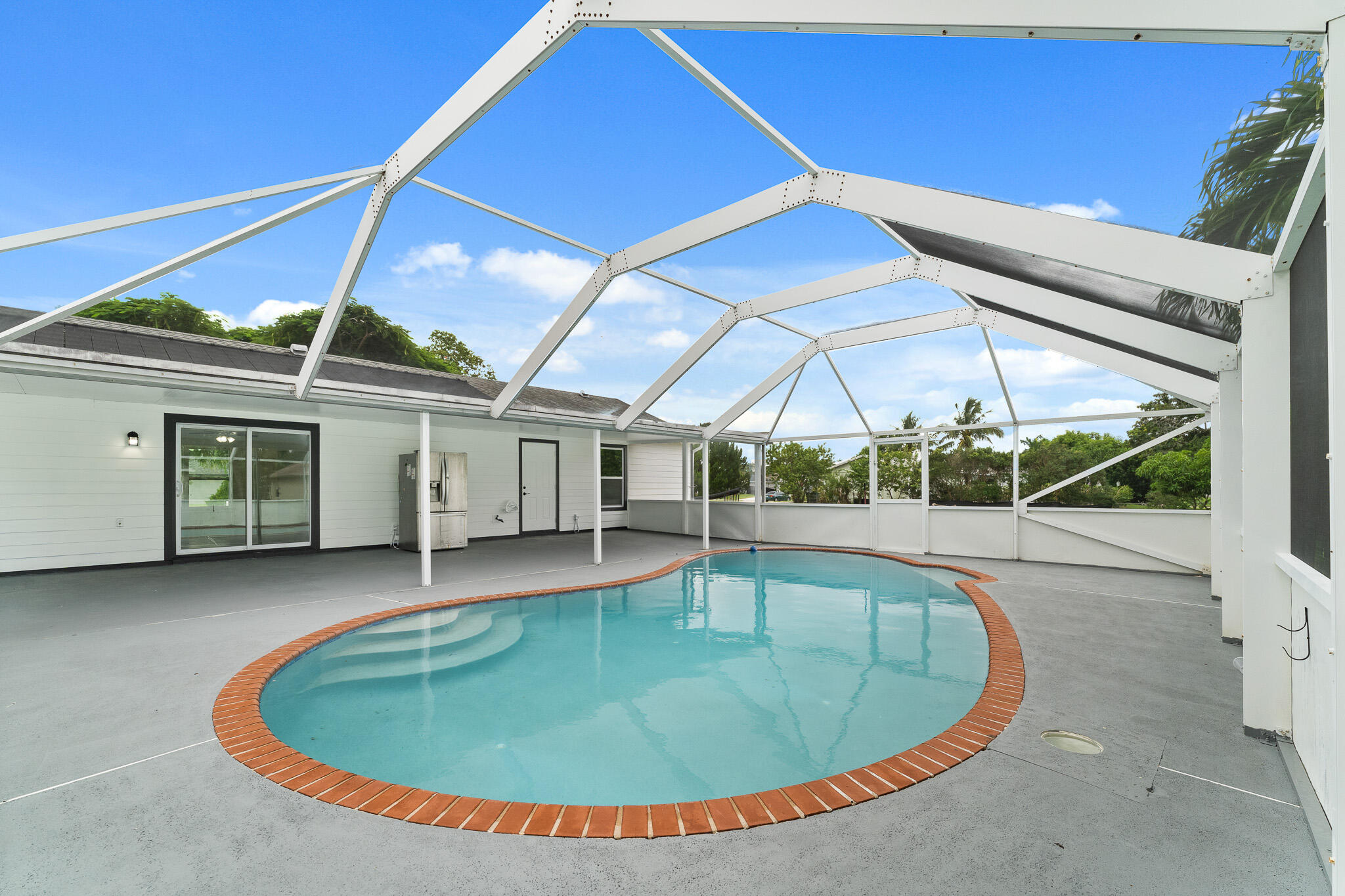 1575 Southwest Fresno Road Port St. Lucie, FL 34953 - Photo 26 of 27 an outdoor space with swimming pool