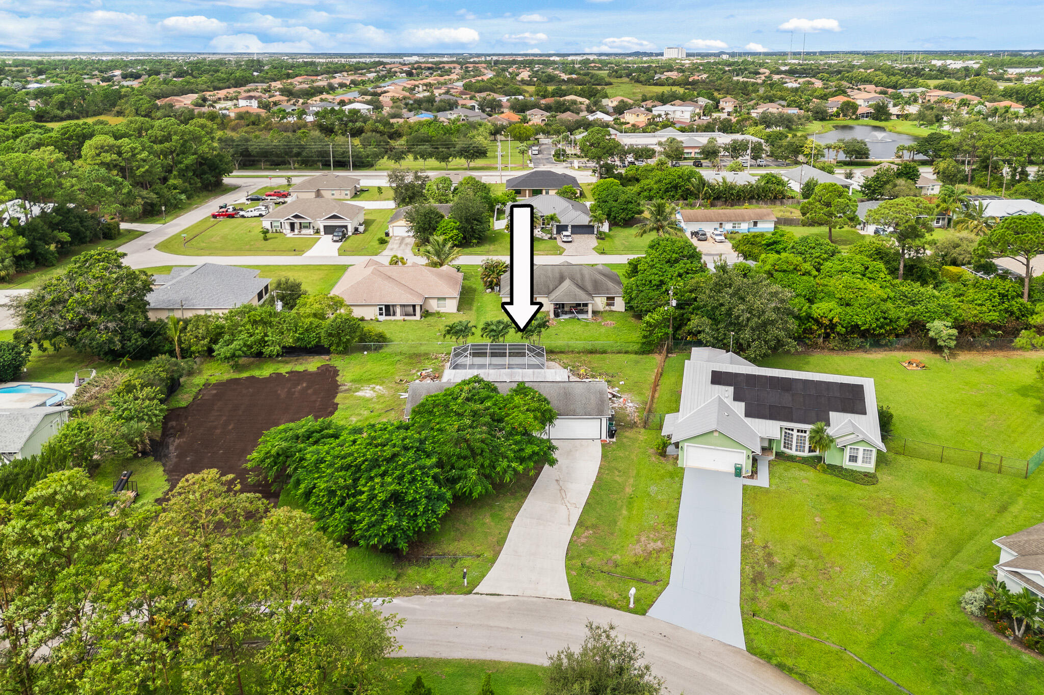 1575 Southwest Fresno Road Port St. Lucie, FL 34953 - Photo 3 of 27 an aerial view of a house with a garden