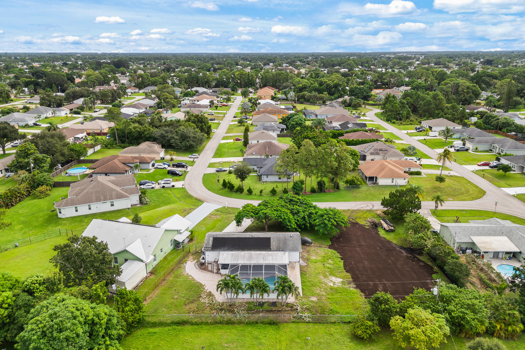 1575 Southwest Fresno Road Port St. Lucie, FL 34953 - Photo 5 of 27 an aerial view of residential houses with outdoor space and trees