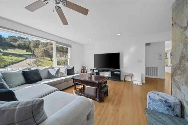 a living room with furniture and a flat screen tv