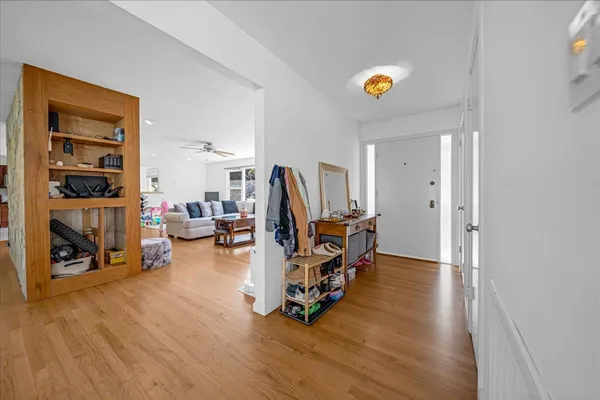 a view of a livingroom with furniture and a flat screen tv