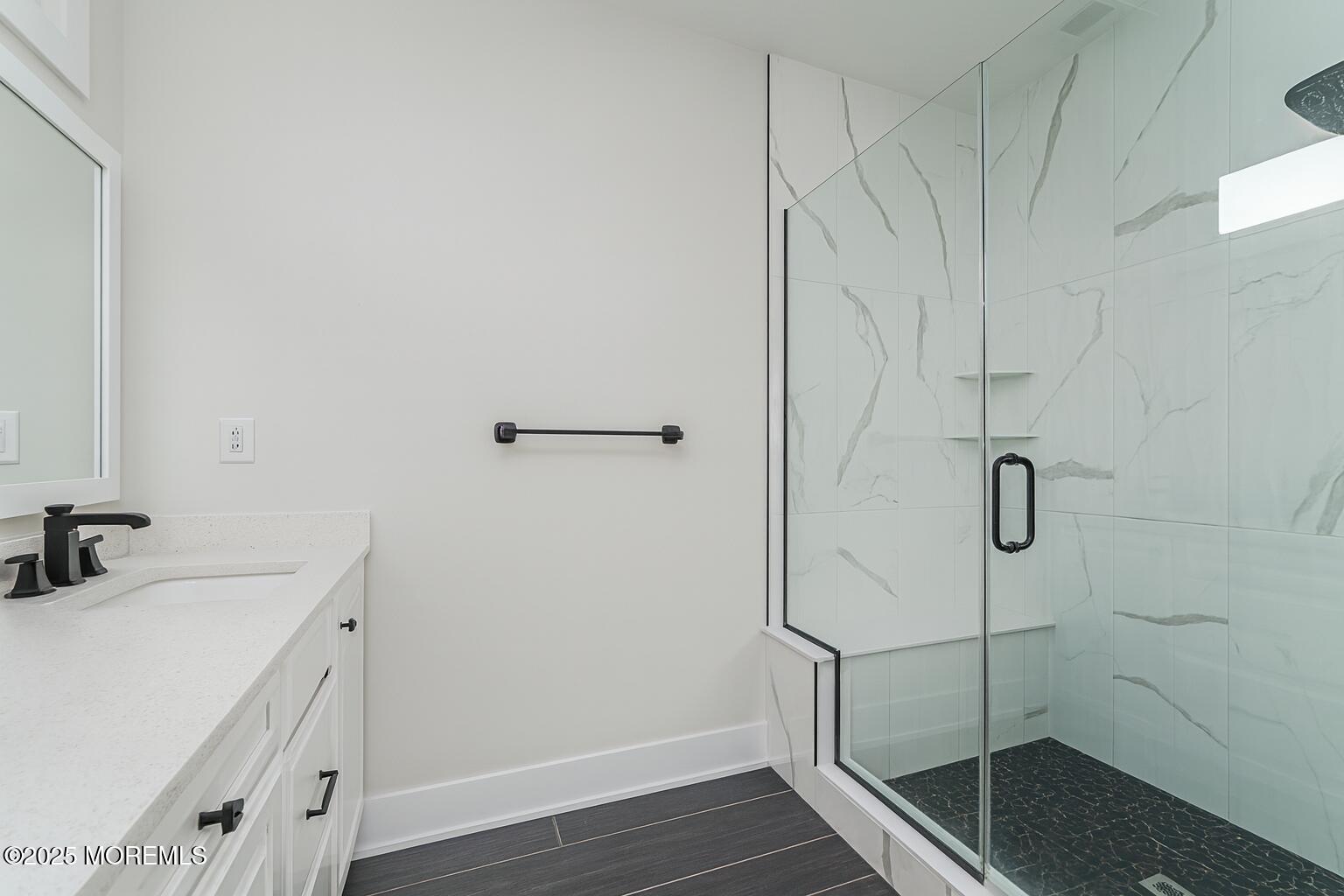 22 Edmund Way Middletown, NJ 07748 - Photo 28 of 49 a bathroom with a sink and shower