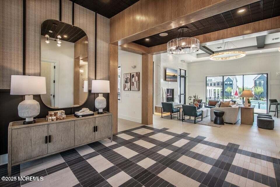 22 Edmund Way Middletown, NJ 07748 - Photo 43 of 49 a living room with furniture and a chandelier