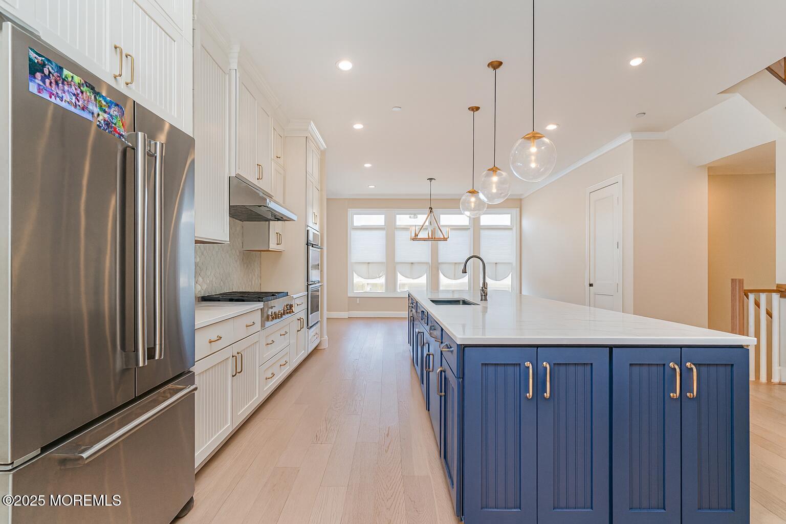 22 Edmund Way Middletown, NJ 07748 - Photo 7 of 49 a kitchen with stainless steel appliances granite countertop a refrigerator a sink dishwasher and a stove with wooden floor