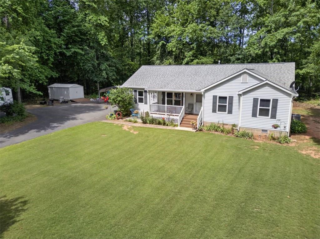 3771 Castleberry Road Cumming, GA 30040 - Photo 58 of 69 a house view with a garden space