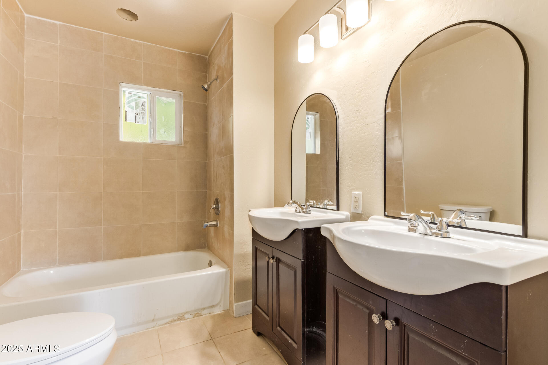 3527 West Almeria Road Phoenix, AZ 85009 - Photo 21 of 32 a bathroom with a sink and a mirror