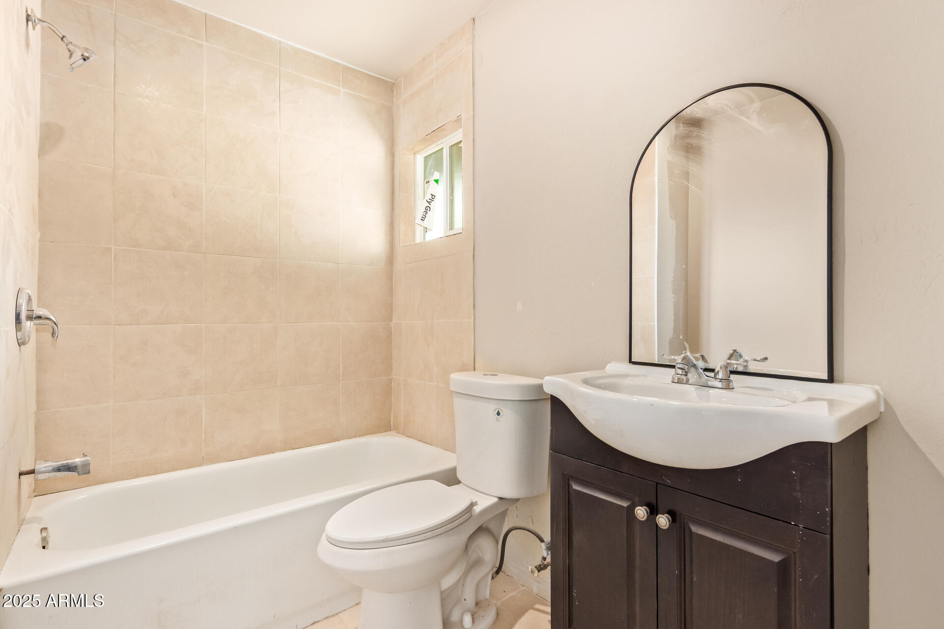 3527 West Almeria Road Phoenix, AZ 85009 - Photo 24 of 32 a bathroom with a sink a toilet and a mirror