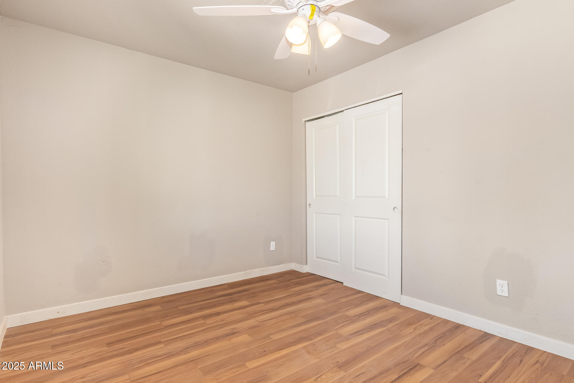 3527 West Almeria Road Phoenix, AZ 85009 - Photo 26 of 32 wooden floor in an empty room