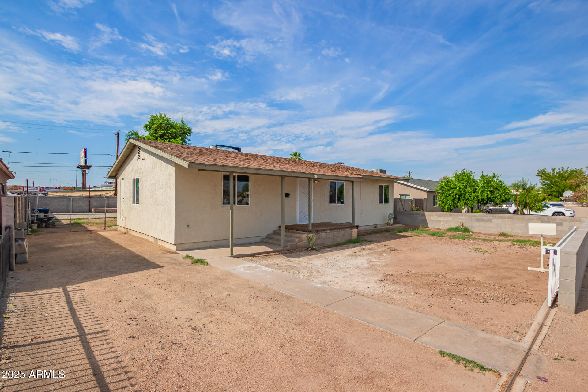 3527 West Almeria Road Phoenix, AZ 85009 - Photo 3 of 32 a view of a house with a patio