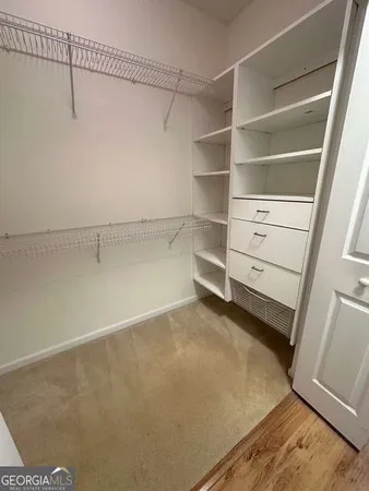 a view of an empty walk in closet