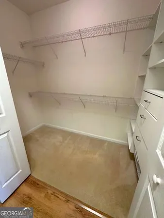 a view of a room with racks on the wall