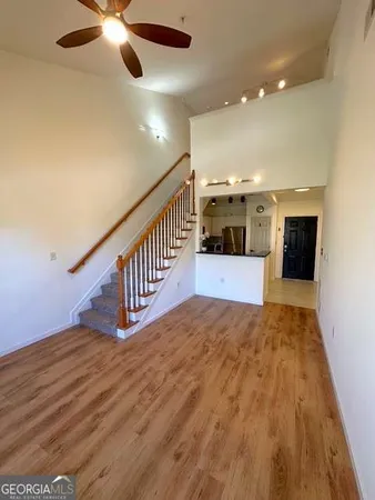a view of an entryway with wooden floor