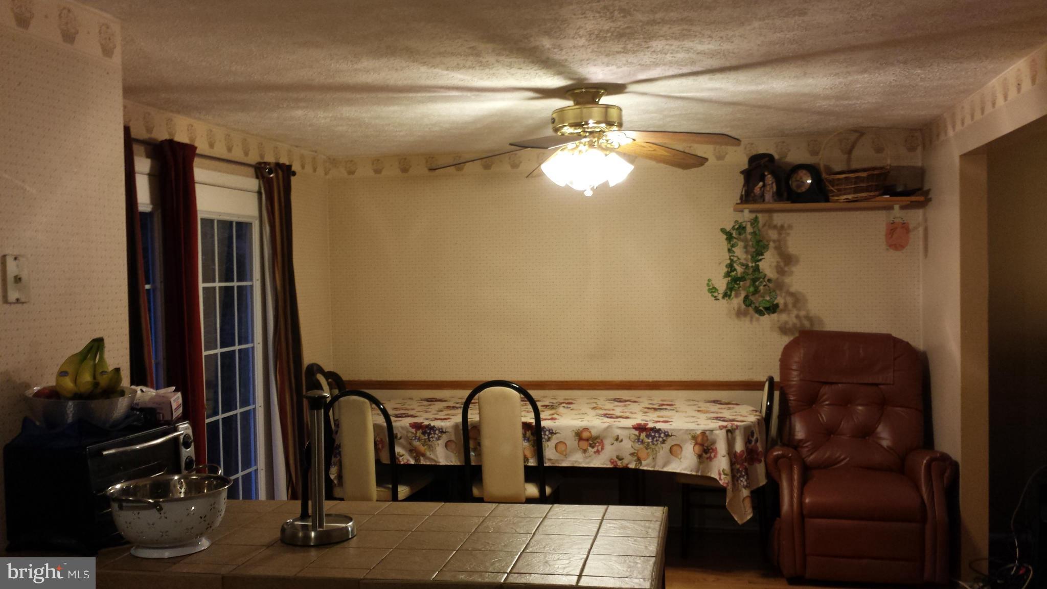 4607 Panacea Road Baltimore, MD 21208 - Photo 20 of 24 a room with furniture and chandelier