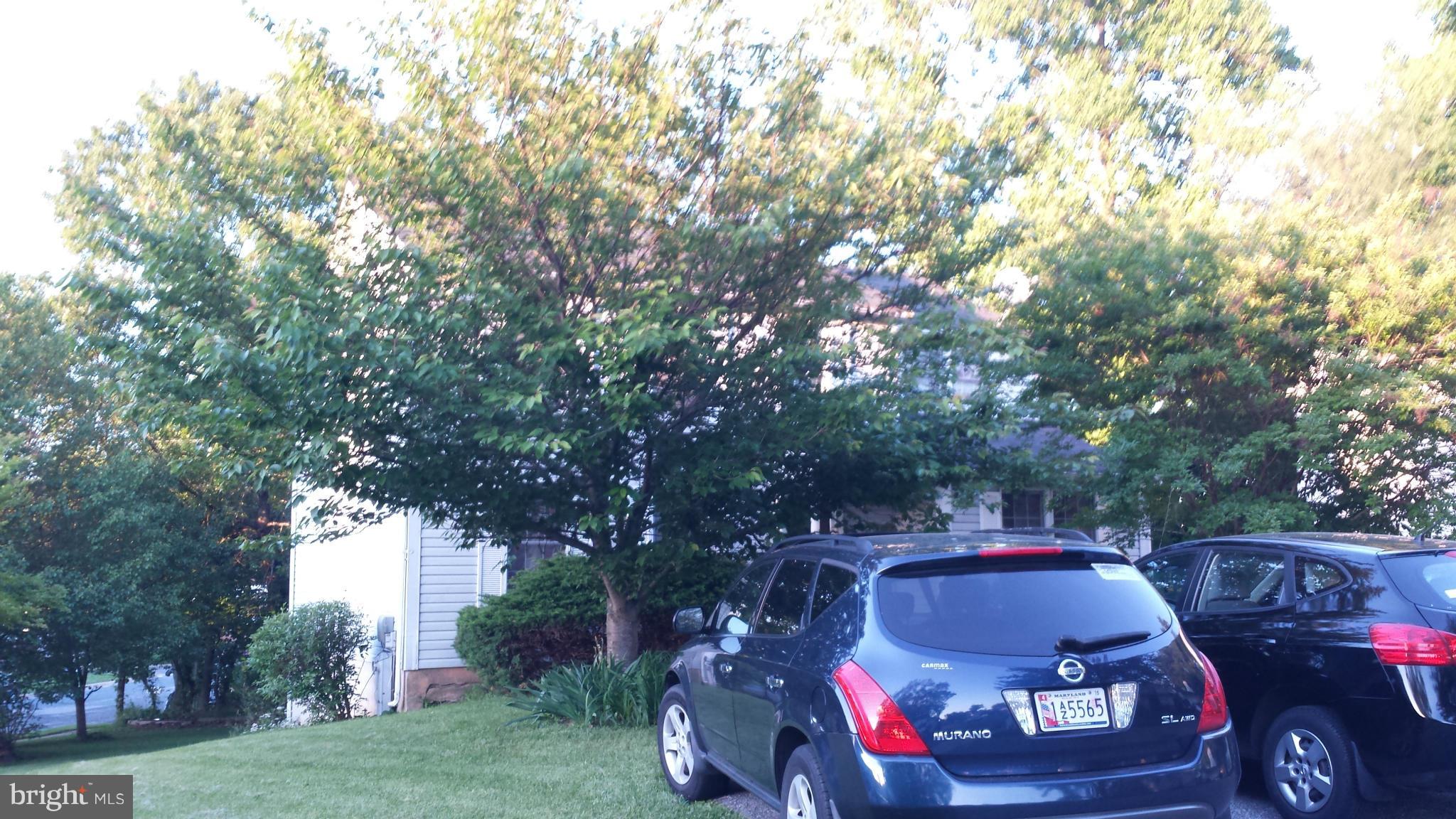 4607 Panacea Road Baltimore, MD 21208 - Photo 3 of 24 a car parked in front of a house